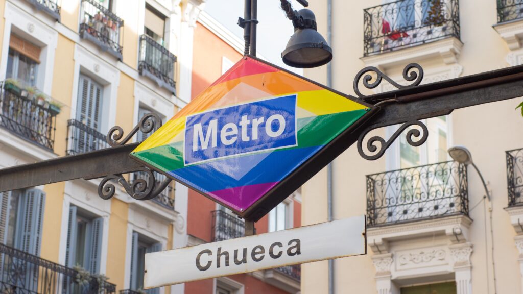 Metro sign in rainbow colours in the neighbourhood Chueca of Madrid